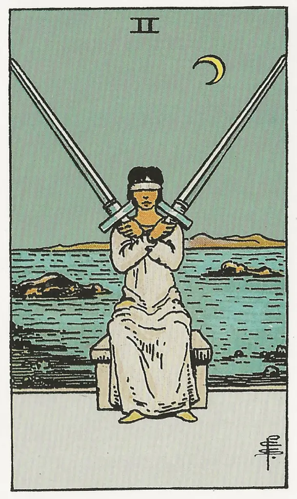 Bild som visar vad två i svärd i tarot betyder